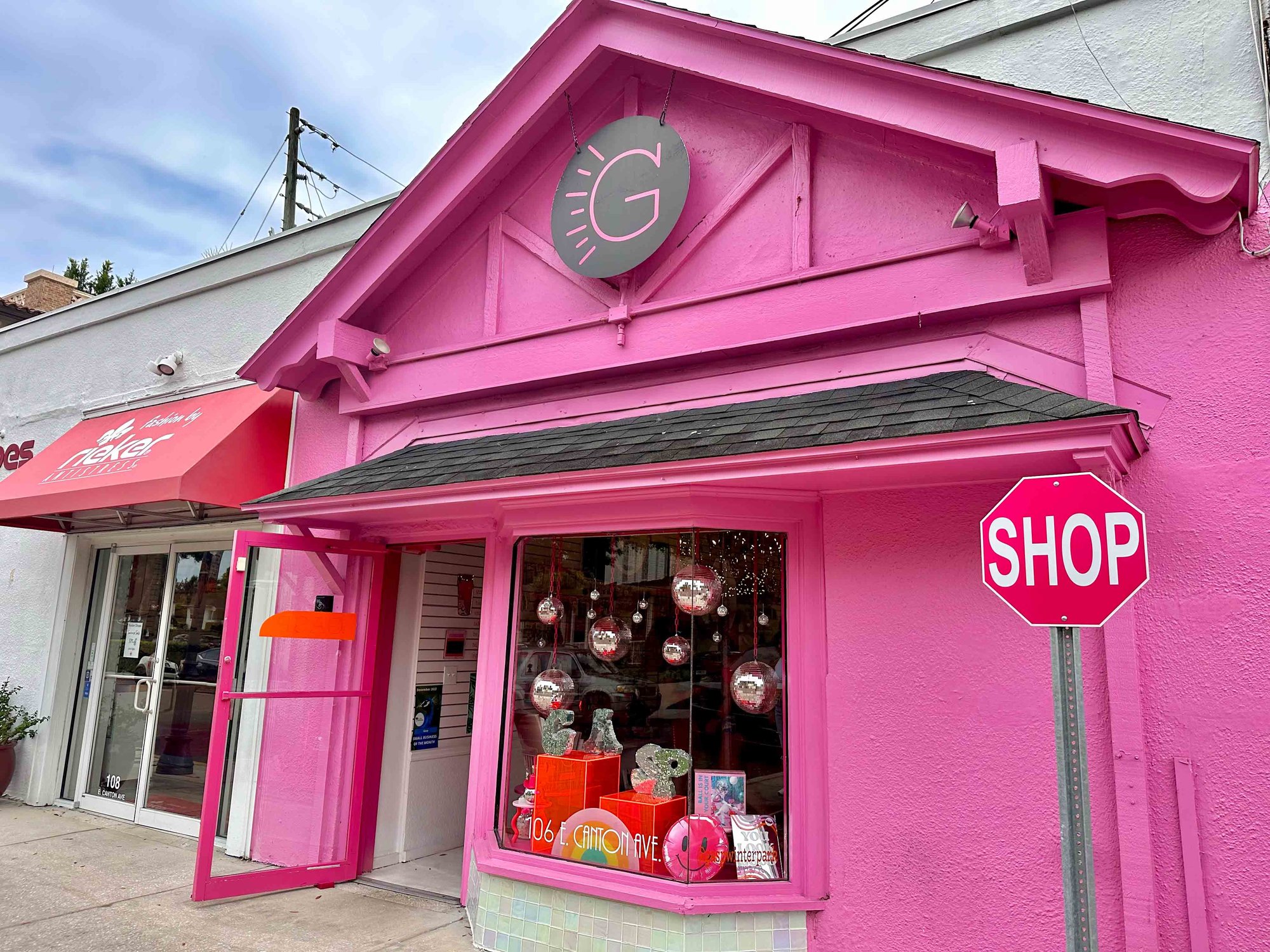 bright pink building with black awning